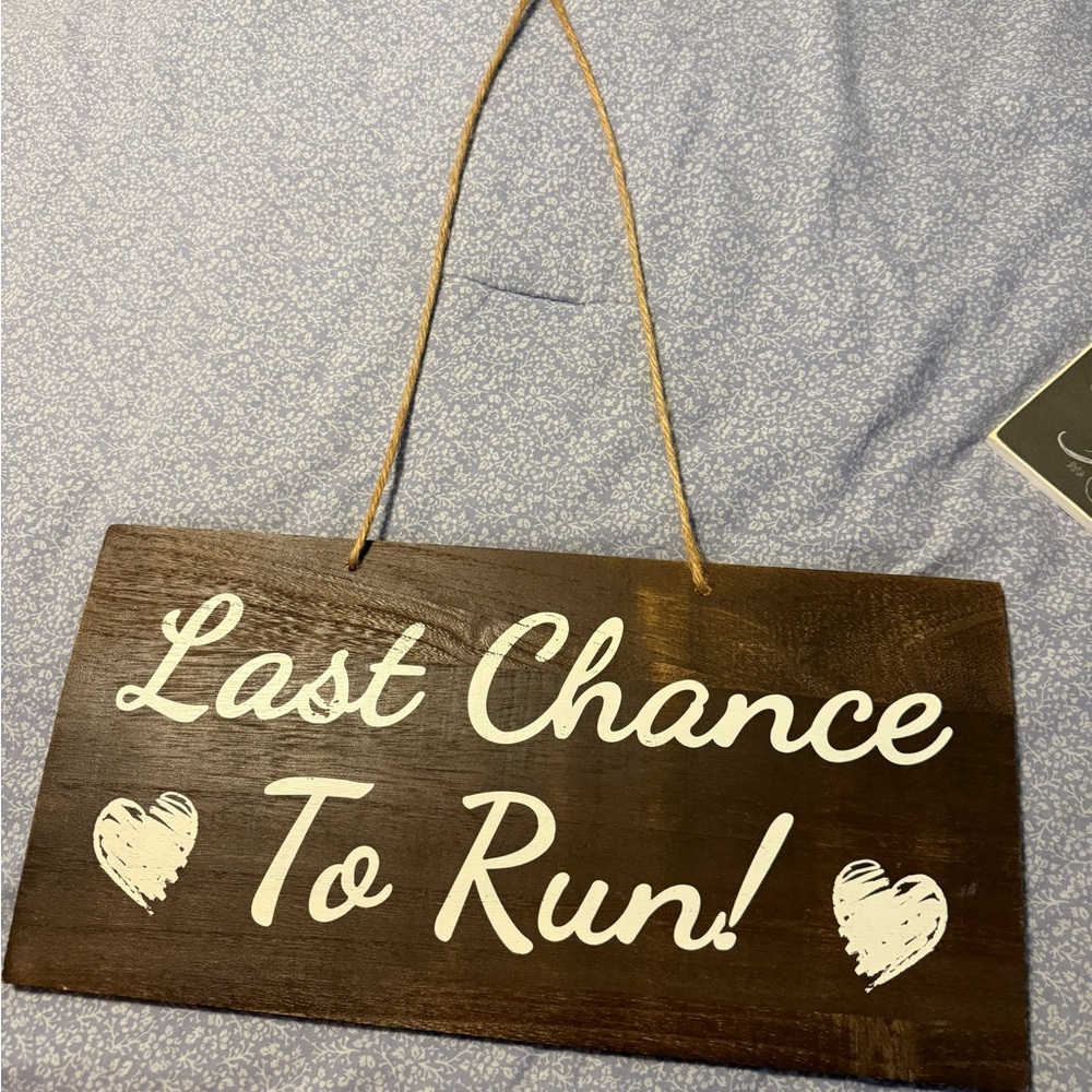 Brown Wooden Sign with White Text